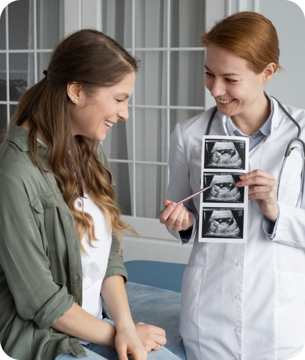Sonographer reviewing prenatal ultrasound images with patient in outpatient clinic, highlighting mobile diagnostic efficiency and secure workflows.