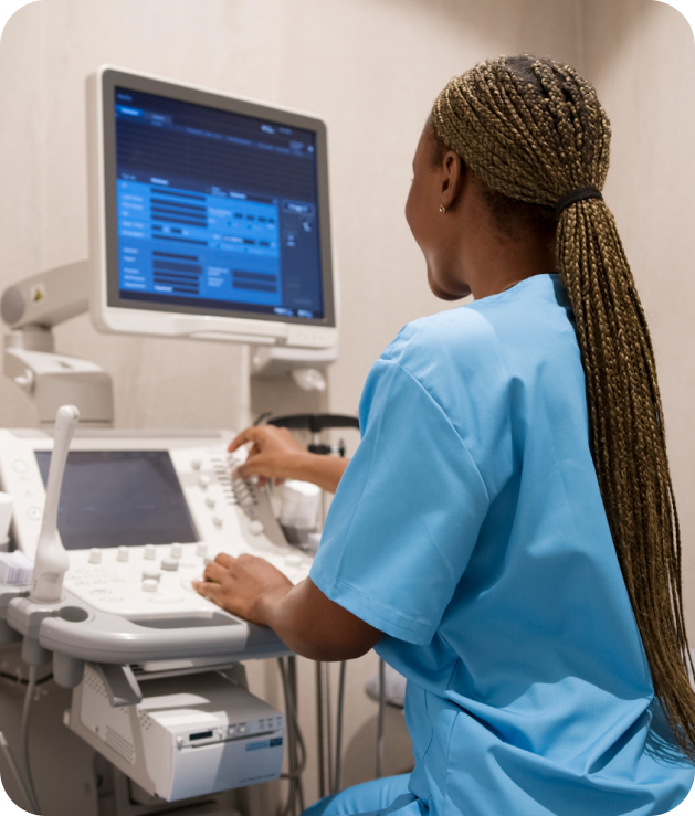 Ultrasound technician operating mobile imaging equipment at nursing facility, promoting safer diagnostics with Soundwaves Imaging.