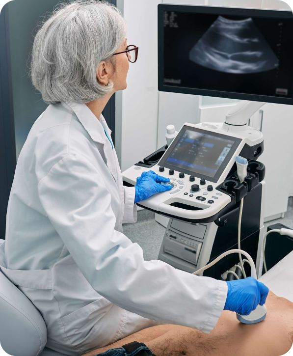 Echocardiogram performed by mobile sonographer using ultrasound machine to assess heart function and valve health.